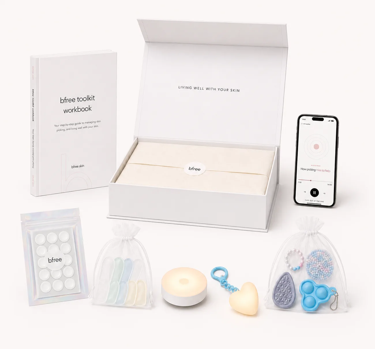 The bfree toolkit: printed workbook, audio sessions, hydrocolloid patches, fidget tools, finger cots and low-intensity lamp, beautifully packaged in the bfree box
