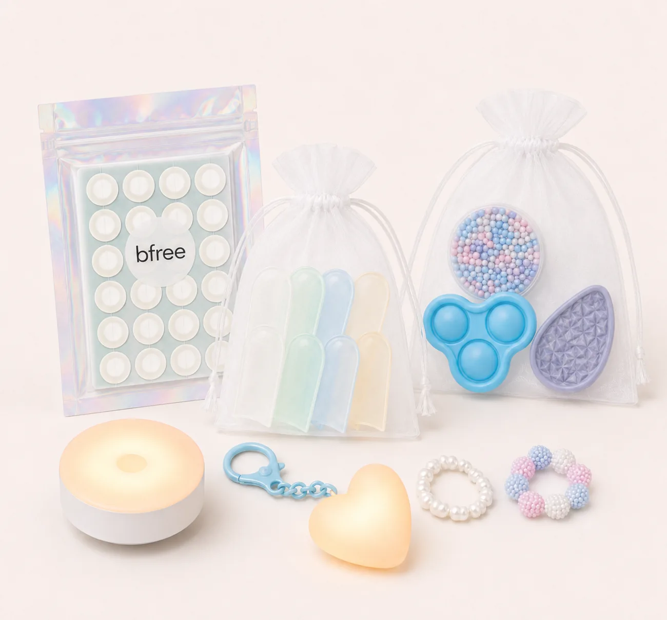 Close up of the toolkit contents: hydrocolloid patches, finger cots, fidget tools, rings and low-intensity lamps
